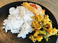 Stir fried pork curry and vegetable with fied egg, spicy Thai food
