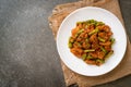 Stir fried pork and red curry paste with sting bean Royalty Free Stock Photo