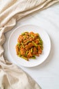 Stir fried pork and red curry paste with sting bean Royalty Free Stock Photo