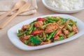 Stir fried pork with yard long bean and red curry paste served with rice, Thai food Royalty Free Stock Photo