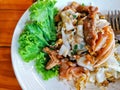 Stir Fried Rice Noodle with Chicken and squid or Kuay Teow Kua Gai Royalty Free Stock Photo