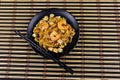 Stir fried rice noodles Pad Thai with prawns and tofu in plate on bamboo mat. Top view. Thai food Royalty Free Stock Photo