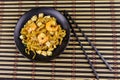 Stir fried rice noodles Pad Thai with prawns and tofu in plate on bamboo mat. Top view. Thai food Royalty Free Stock Photo