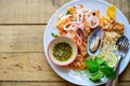 Stir-fried rice noodles Pad Thai with shrimp, mussels and squid Royalty Free Stock Photo