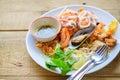 Stir-fried rice noodles Pad Thai with shrimp, mussels and squid Royalty Free Stock Photo