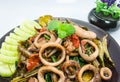 Stir-fried salted egg with squid on dish, traditional Thai food