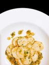 Stir Fried scallop with garlic butter on black isolated