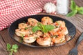 Stir-fried Shrimp with pepper and garlic on black plate. Royalty Free Stock Photo