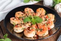 Stir-fried Shrimp with pepper and garlic on black plate. Royalty Free Stock Photo