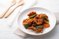 Stir Fried Snakehead Fish with Red Curry Paste on white plate Royalty Free Stock Photo