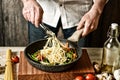 Stir-fried spaghetti with assorted vegetables - traditional italian recipe - selective focus - desaturated effect Royalty Free Stock Photo