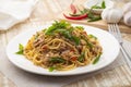 Stir fried Spaghetti with Canned tuna fish and crispy basil leaves