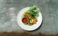 Stir-Fried Spicy Shanghai Noodle with Seafood. White plate of spicy fried Shanghai noodles with basil leafs and hot chili with Royalty Free Stock Photo