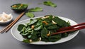 Stir-Fried Spinach with Garlic with chopsticks Royalty Free Stock Photo