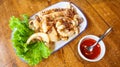 Stir fried squid with crispy garlic and pepper (Pla Muek Tod Gra Tium