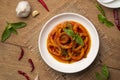 Stir-Fried Squid with Red Curry Paste in white plate.Thai spicy food. Royalty Free Stock Photo