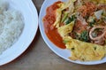 Stir fried sukiyaki with seafood wrapped in egg eat with plain rice Royalty Free Stock Photo