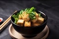 Stir fried tofu in a bowl with chopsticks. Generative AI. Vegan, vegetarian and asian food Royalty Free Stock Photo