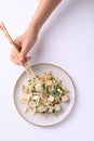 Stir fried tofu with mung bean sprouts eating by using chopsticks Royalty Free Stock Photo