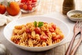 Stir fried trivelle pasta with tomatoes sauce Royalty Free Stock Photo