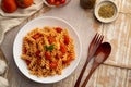 Stir fried trivelle pasta with tomatoes sauce on a plate. Royalty Free Stock Photo