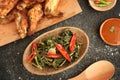 Stir fried water spinach or cah kangkung. Traditional asian indonesian food, cooked veggies, spicy vegetable dish for vegan,