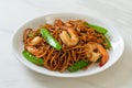 Stir-fried yakisoba noodles with green peas and shrimps