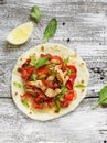 Stir fry of chicken breast and sweet red peppers on homemade tortillas Royalty Free Stock Photo