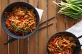 Stir-fry chicken with noodles, vegetables and herbs, with oyster and soy sauce. Asian style dish, top view Royalty Free Stock Photo