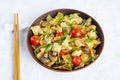 Stir fry farfalle pasta with vegetables, cauliflower and mushrooms Royalty Free Stock Photo