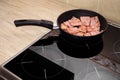 Stir-fry the luncheon meat in a frying pan Royalty Free Stock Photo