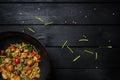 Stir fry noodles in traditional Chinese wok. Space for text. Top view. Royalty Free Stock Photo