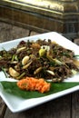 Stir fry Spilt Gill Fungus with white chillies and local onion. Royalty Free Stock Photo