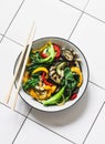 Stir fry vegetables in asian style. Quickly roasted wok vegetables - bok choy, eggplant, bell pepper, zucchini on a light Royalty Free Stock Photo