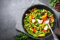 Stir fry vegetables in the wok.