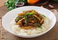 Stir frying beef with sweet peppers, green beans