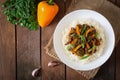 Stir frying beef with sweet peppers, green beans