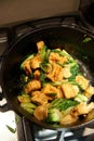 Stir frying tofu and bok choy