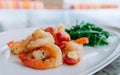 Stirfried shrimps with butter garlic and rocket salad