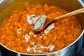 Stiring gelling sugar in white cooking apricots Royalty Free Stock Photo