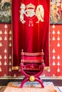 Medieval room of Stirling Castle with decorated throne and walls