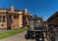 View of the Stirling Castle courtyard with cannons on the battlements and the Great Hall in the background