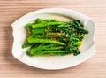 stirred fried seasonal vegetable chinese broccoli or kai lan with chopped garlic served in dish isolated on table top view of hong Royalty Free Stock Photo