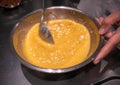 Stirring banana puree in a bowl.