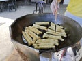 stirring Chinese fried dough in the hot oily cooking pan Royalty Free Stock Photo