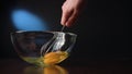 Stirring Eggs in a Glass Bowl with a Whisker