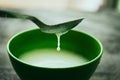 Stirring milk in a bowl