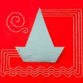 Stitched Silver Boat on a Red Background