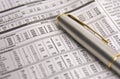 Stock charts with a gold and silver pen Royalty Free Stock Photo