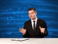Stock data analyst in studio giving adivce on blue chart backgro Royalty Free Stock Photo